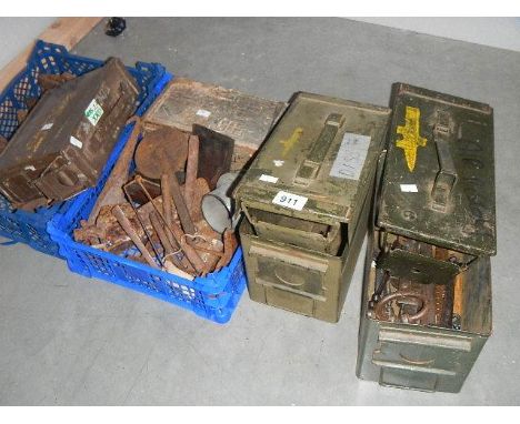 2 ammunition tins, a quantity of cast iron shoe lasts, tools etc.,
