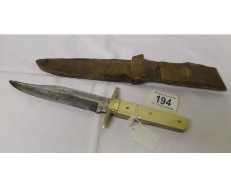 A Wilkinson Bowie knife in sheath.