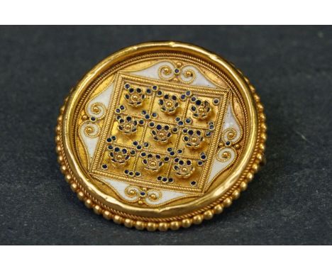 Indian yellow metal target-style  enamelled yellow metal brooch, nine small cast flower heads in relief, navy blue enamelled 