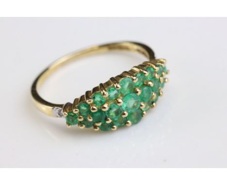 Emerald and diamond 9ct yellow gold ring, the marquise shaped head comprising twenty-one graduated round mixed cut emeralds, 