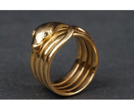 18ct yellow gold ring modelled as a coiled snake, rose cut diamond eyes, width approx 11mm, ring size R, hallmarked partially