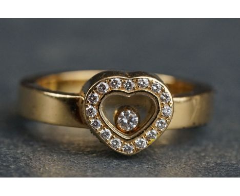 Chopard Happy Diamonds diamond 18ct yellow gold heart ring, the heart shaped compartment containing a freely moving collet se