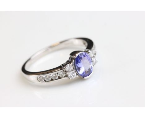 Tanzanite and diamond 14ct white gold ring, the oval mixed cut tanzanite measuring approx 6.5mm x 4.5mm, partial collet setti