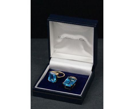 Swiss blue topaz 9ct yellow gold ring, the rectangular mixed cut topaz measuring approx 12mm x 10mm, four claw setting, taper