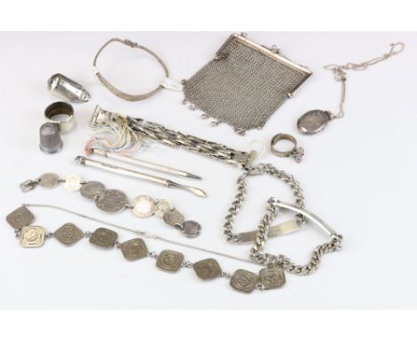 Silver chainmail coin purse, two silver identity bracelets, one plain and one named, silver locket, silver propelling pencil,