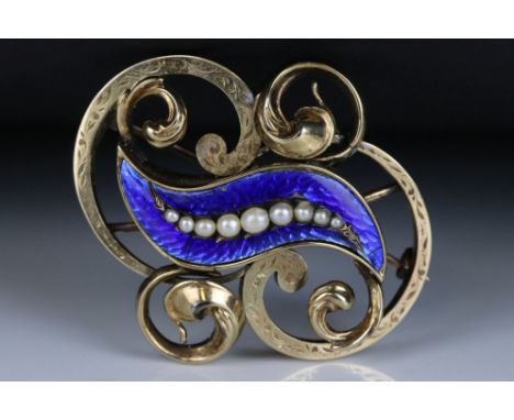 Victorian pearl enamelled yellow metal brooch, the blue guilloche enamel set with nine graduated seed pearls, sinuous cast an