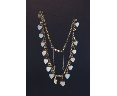 Edwardian opal and ruby yellow metal drop pendant necklace, comprising seventeen heart shaped cabochon cut precious white opa