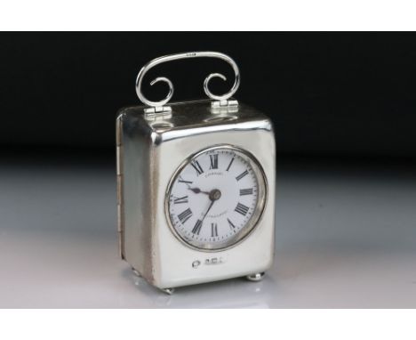 Edwardian silver cased dressing table carriage clock, the white enamel dial stamped Emanuel Southampton, black Roman numerals