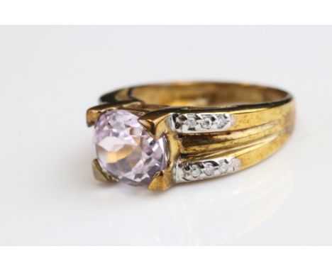 Kunzite and diamond 9ct yellow gold ring, the oval mixed cut pale pink kunzite measuring approx 7.5mm x 9.5mm, four claw sett