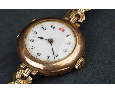 Early 20th century Rolex 9ct rose gold wristwatch, the circular white enamel dial with red and black Arabic numerals, poker h