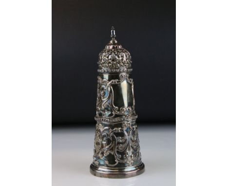 Early Victorian silver lighthouse-shaped sugar shaker, repoussé foliate scroll decoration in high relief to the body, bead bo