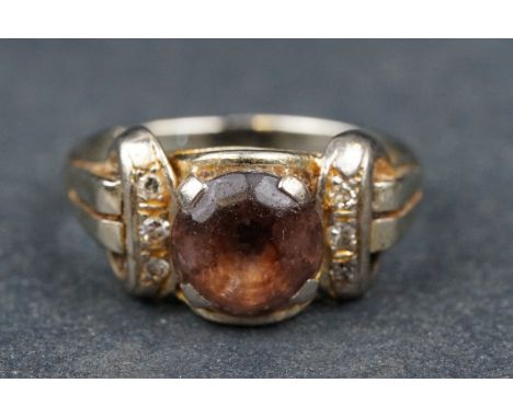 Quartz and diamond 18ct white gold ring, the round quartz diameter approx 8mm, three small round eight cut diamond set to eac