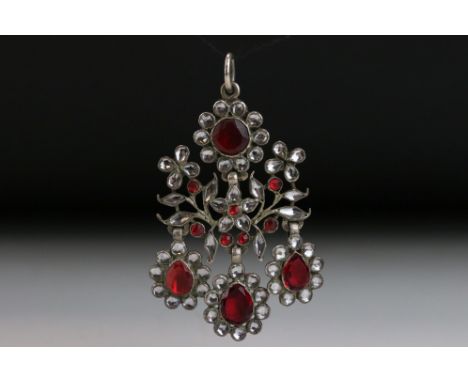George III Vauxhall glass white metal articulated pendant, the flower heads set with red Vauxhall glass centres and silvered 
