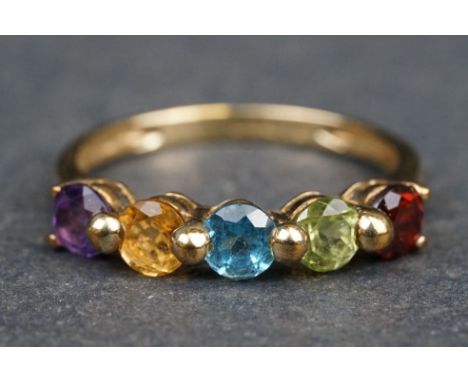 Multi-gem 9ct yellow gold five stone ring, comprising garnet, peridot, topaz, citrine and amethyst, claw and shared bead sett