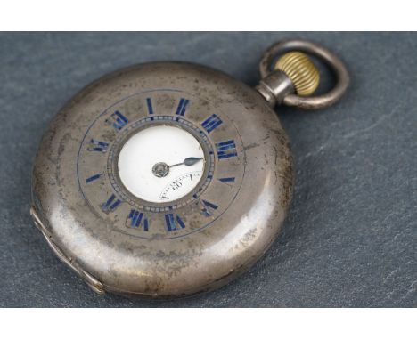 Silver half hunter top wind pocket watch, the white enamel dial with black Arabic numerals and subsidiary seconds dial, one h