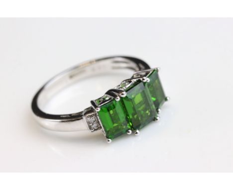 Chrome diopside 18ct white gold three stone ring, three graduated rectangular mixed cut chrome diopside, the principle stone 