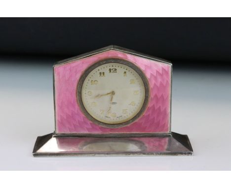 Art Deco enamelled silver 8 day dressing table clock, the champagne dial with gold Arabic numerals and poker hands, Greek key