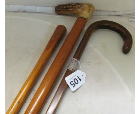 A horn handle walking stick with silver ferrule and another