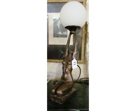 A lamp nude lady holding light above head
