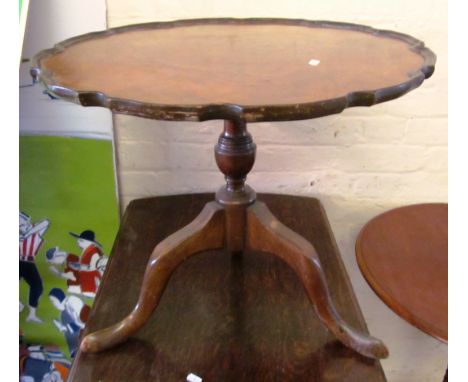 A walnut frilled edge occasional table on tripod supports 24”dia x 19.5”k