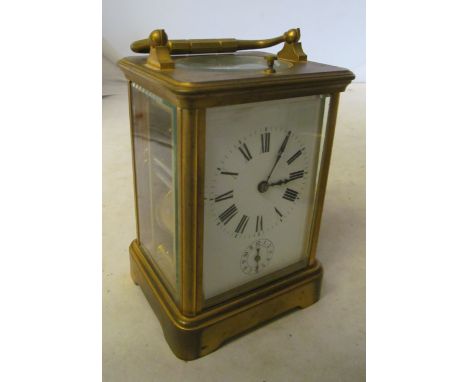 A brass carriage clock with alarm dial and repeat (strike and repeat not working) alarm working