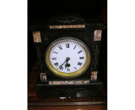 A Victorian black slate and marble mantel clock with eight day movement