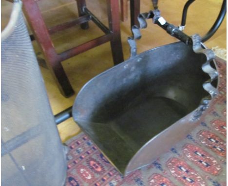 A metal coal scuttle and firescreen