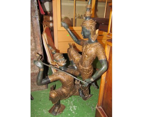 A bronze group two Thai figures balancing in two sections held together by stabilising stick 32" high