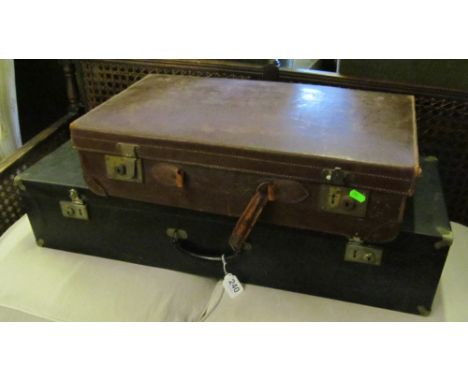 A long case, a leather case and a small floor standing lamp