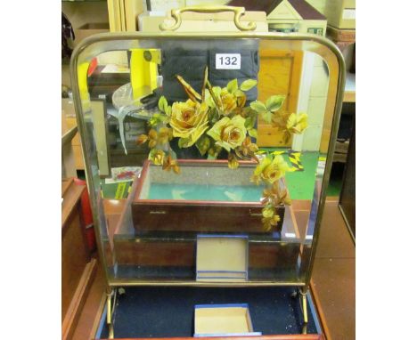 A brass firescreen painted roses and a fender