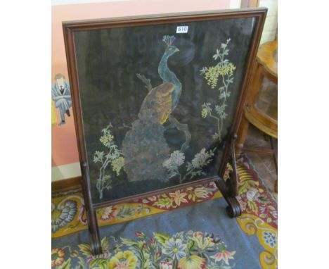 A firescreen peacock on knurled feet