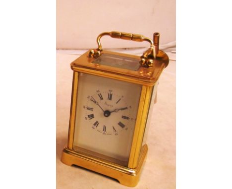 A gilt brass carriage clock retailed Aspreys