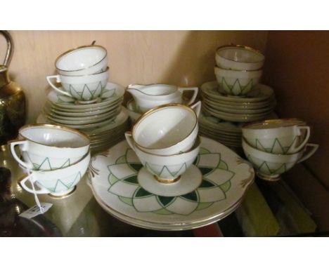 A Royal Doulton Orion teaset:- two bread plates, twelve plates, twelve saucers, ten cups, sucrier and bowlSide plates very mi