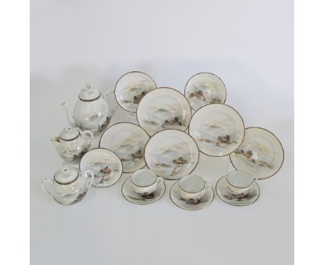 A Japanese eggshell porcelain tea set, hand painted with landscapes within black and gilt borders. The saucers with unusual e