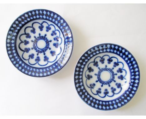 Two English flow blue ceramic dishes with geometric decorations, c1874-1924 with an impressed mark of George Jones, manufactu