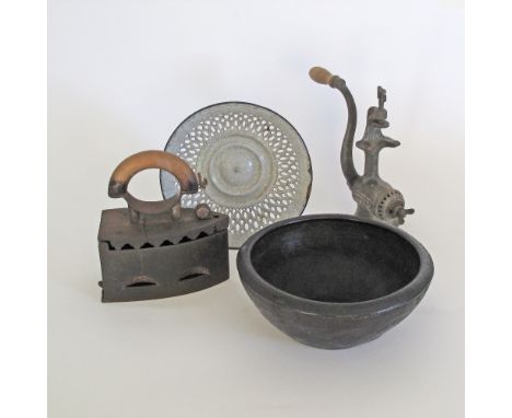 A collection of 19th century and later antique household devices comprising an iron, an enamelled reticulated bowl W26cm, a c