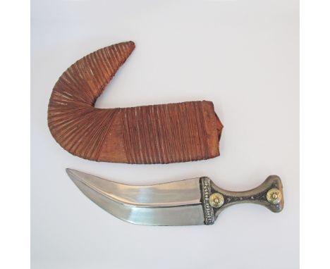 An Islamic Ottoman Yemenite Jambiya dagger / Khanjar with a metal mounted horn handle in a leather covered wooden scabbard. O