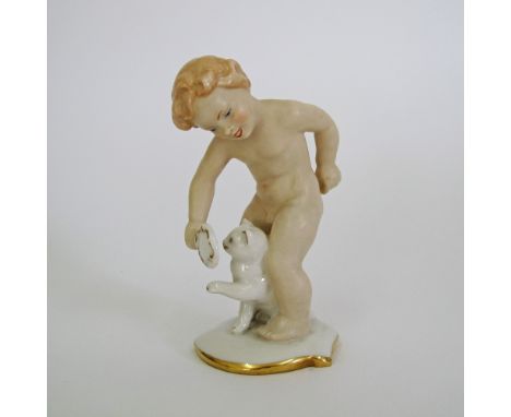 A German Alka Bavaria porcelain figure of a boy and a cat in bisque porcelain partly glazed and trimmed with gold. C1950s. H1
