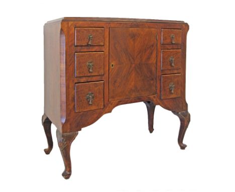 A Queen Ann style dressing table / lowboy / vanity, quarter veneered and burr walnut, with shaped apron, a central cupboard f