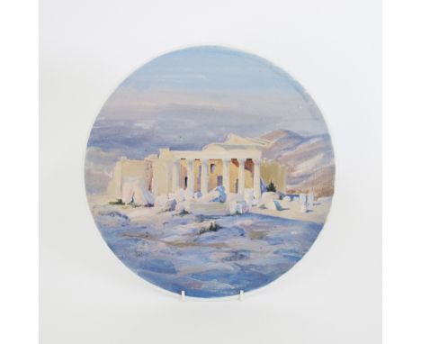 An impressive Greek Kerameikos ceramic charger decorated with a landscape of ancient Greek ruins in pale colours, marked Athe