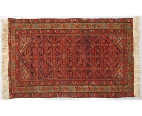 An Iranian Carpet 200X125cm with restored fringes. Pile wear.
In-house packing &amp; shipping in the EU at €98.