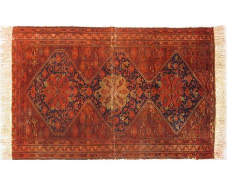 An Iranian Carpet with a tear and restoration 200X130cm with restored fringes. Pile wear.
In-house packing &amp; shipping in 