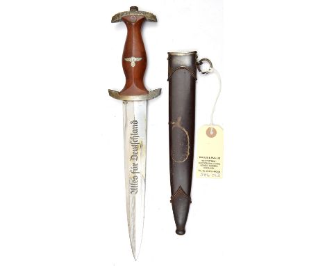A Third Reich SA dagger,  the blade etched with RZM mark over “M7/83” (Richard Pluemacher Sohn, Solingen), the hilt with plat