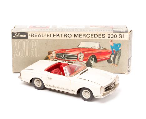 A Schuco ‘Real Elektro’ Mercedes 230SL (5500). Comprising a Mercedes in cream with red interior, steering wheel, steering cab