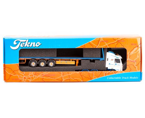 A recent issue Tekno 1:50 scale truck. A Scania 143m 6x2 tractor unit with a 3-axle flatbed trailer in the white, blue and or