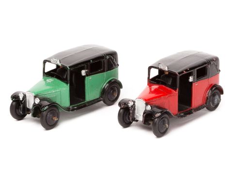 2 Dinky Toys TAXI 36g. An example in red and black and another in light green and black, both with closed rear windows, ridge