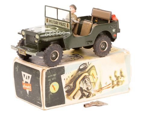 An Arnold Jeep Freilauf ‘Free wheel’ 2500. A clockwork Willys Jeep in U.S. Army ‘Military Police’ olive green with star to bo