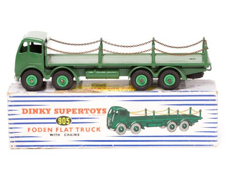 Dinky Supertoys Foden FG Flat Truck with chains No.905. An example in dark green with mid green wheels. Boxed, some wear/dama