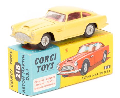 A Corgi Toys Aston Martin D.B.4 (218). An example in primrose yellow with red interior, example with bonnet vent and with det