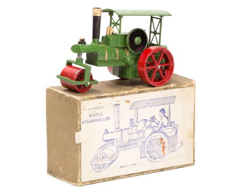 A Charbens Model Steam Roller. An example with light green body, red 12 spoke wheels, a red roller and a black copper coloure